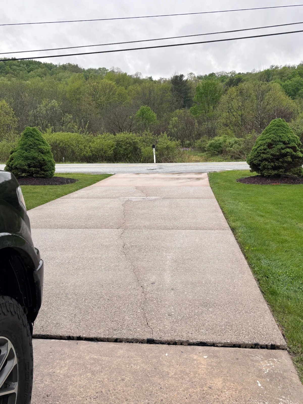 Driveway before and after pressure washing by Ford's Pro Wash